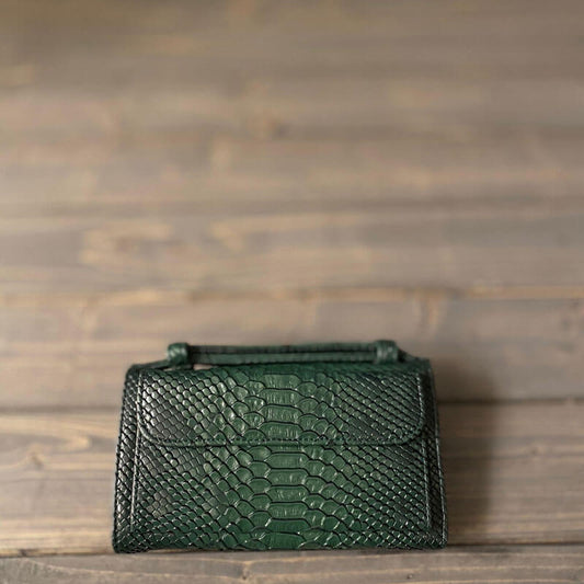 Dark Green Crocodile Skin Clutch Bag From Lulwa Al Khattaf