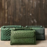 Picture of Dark Green Crocodile Skin Clutch Bag From Lulwa Al Khattaf