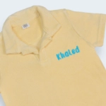 صورة قماش منشفة قميص أصفر (مع امكانية تطريز الاسم)
